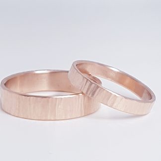 Wedding rings in 9ct hammered, rose gold