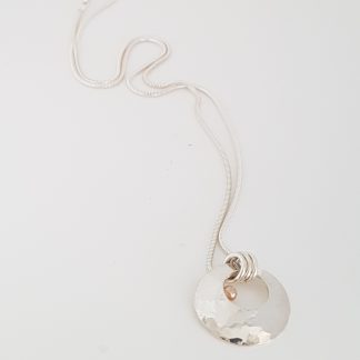 Sterling silver pendant with gold bead