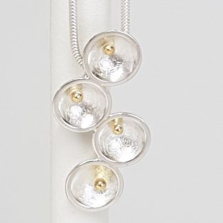 Sterling silver pendant with gold beads